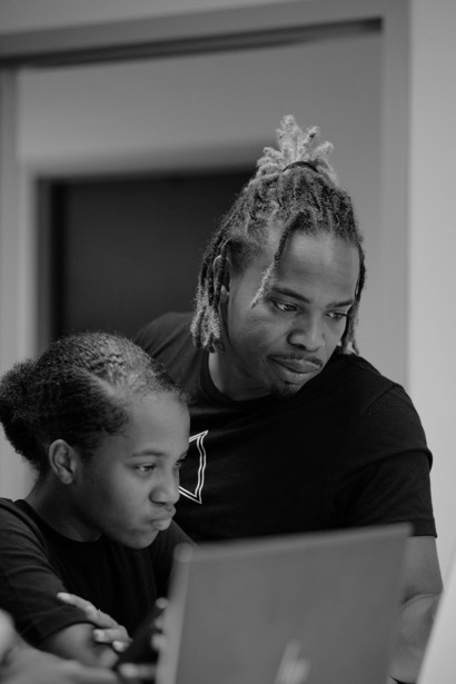 Child and parent image representing family-centered impact